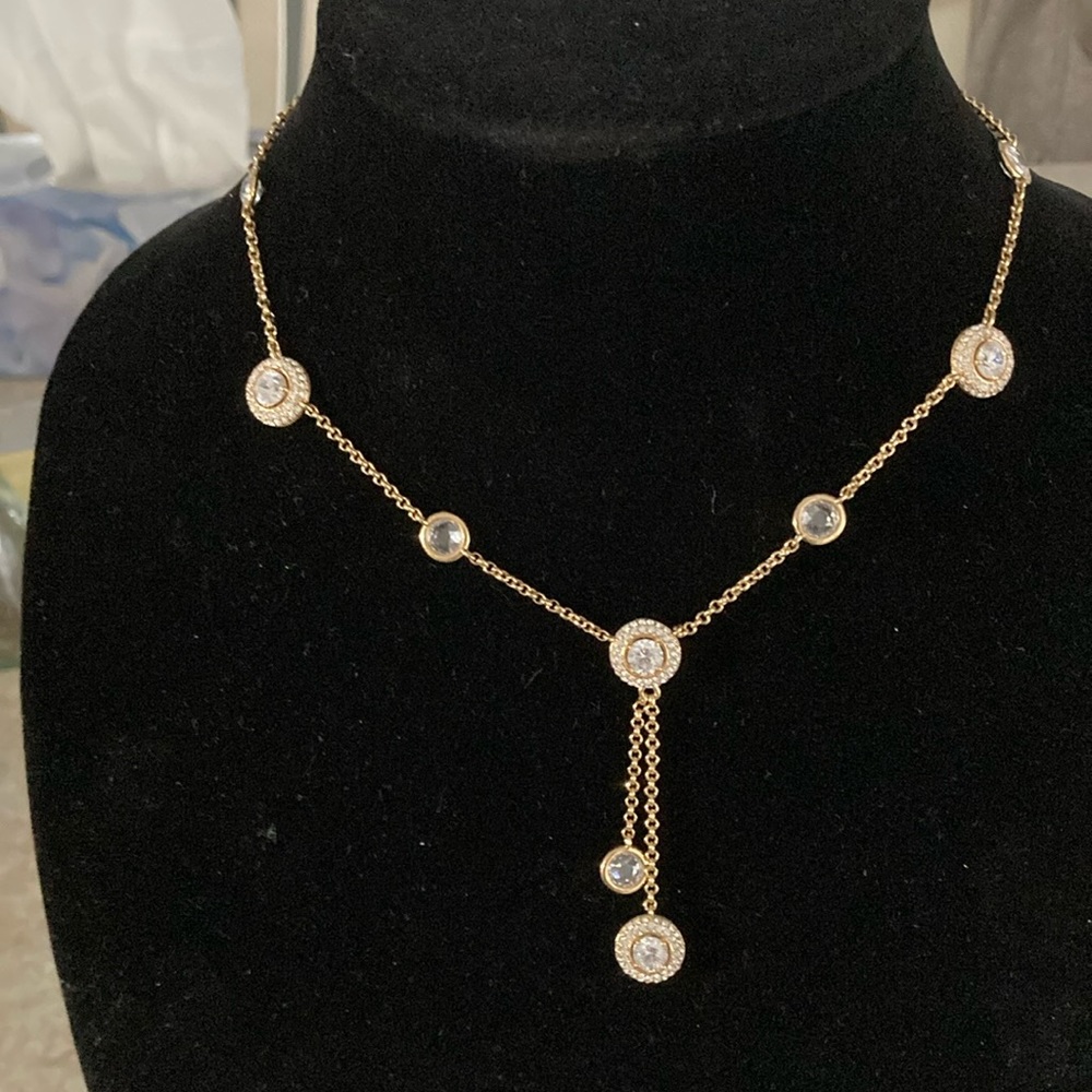 Gold tone lariat necklace with Swarovski crystals.